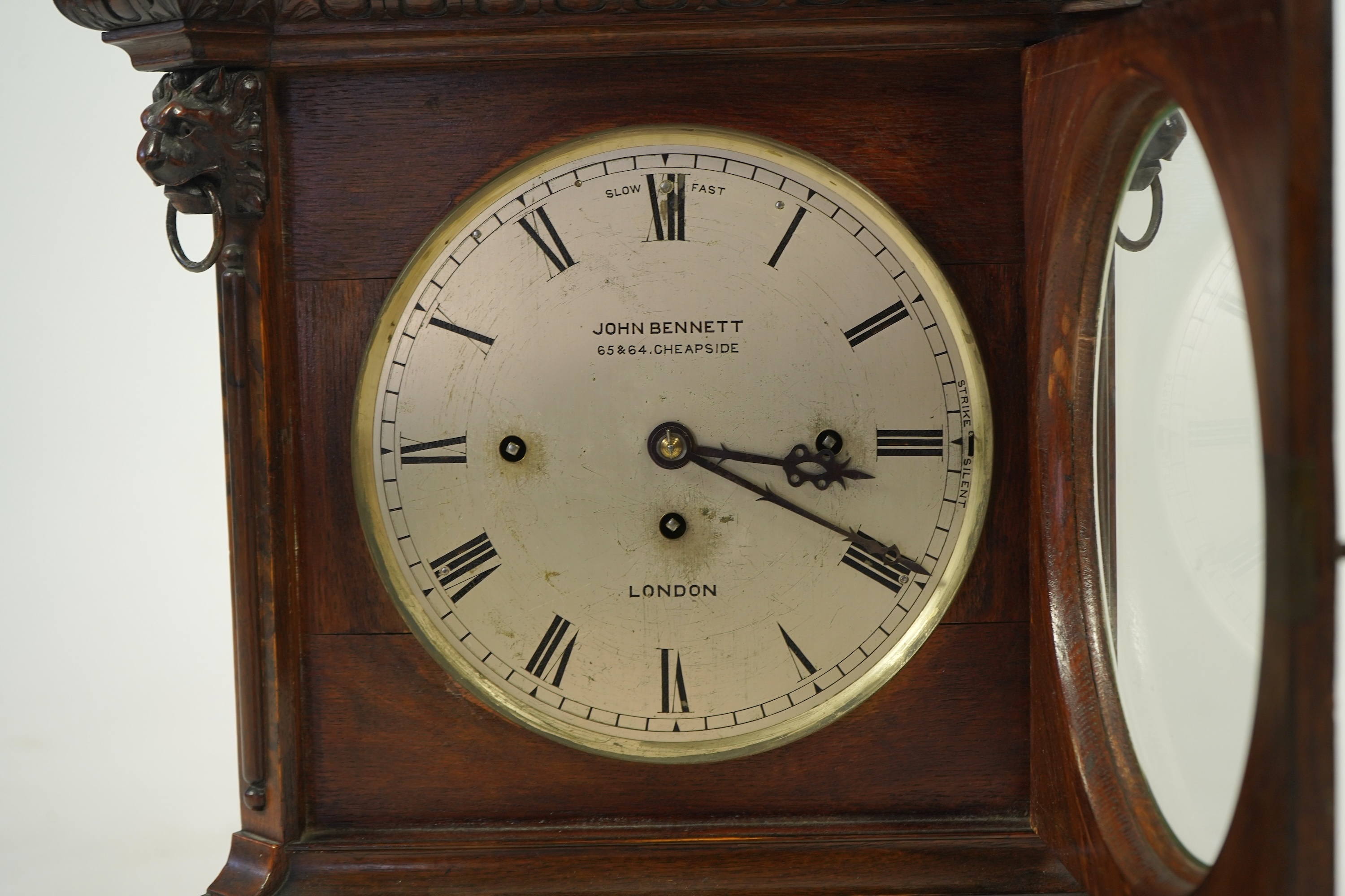 A late 19th century carved oak triple fusee bracket clock